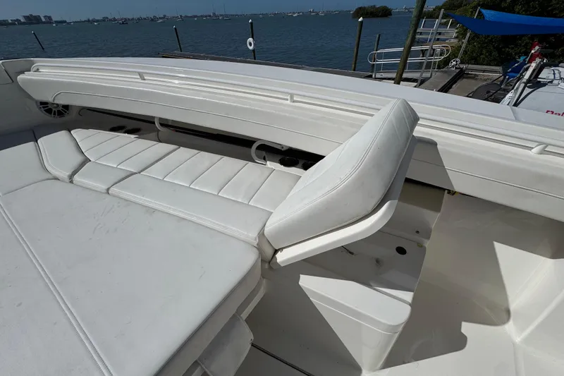  Yacht Photos Pics 2023 Regulator 31 boat interior with white cushioned seating and ocean view.