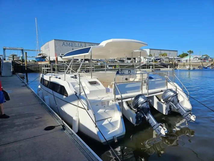  Yacht Photos Pics Modern Smart Cat M280 Power catamaran docked at marina, featuring dual outboard engines.