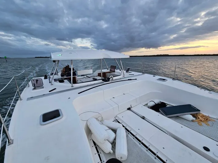  Yacht Photos Pics Modern Smart Cat M280 Power catamaran cruising at sunset, 2025 model.