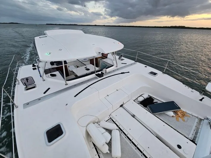  Yacht Photos Pics Modern Smart Cat M280 Power catamaran cruising on calm waters at sunset, 2025 model.