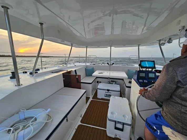  Yacht Photos Pics 2025 Smart Cat M280 Power boat interior at sunset, featuring modern navigation equipment.