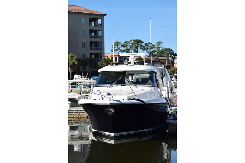  Yacht Photos Pics 2025 Tiara Yachts 43 LE docked at marina, front view.