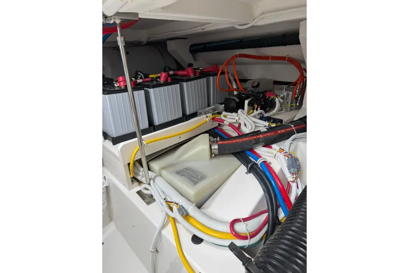  Yacht Photos Pics Engine compartment of 2025 Tiara Yachts 43 LE, showcasing batteries and wiring.