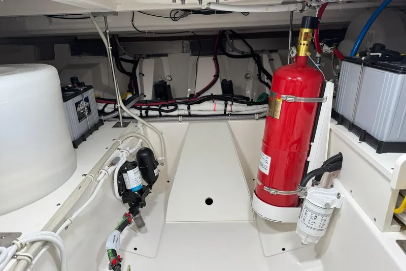 Yacht Photos Pics Engine room of 2025 Tiara Yachts 43 LE with fire extinguisher and batteries.