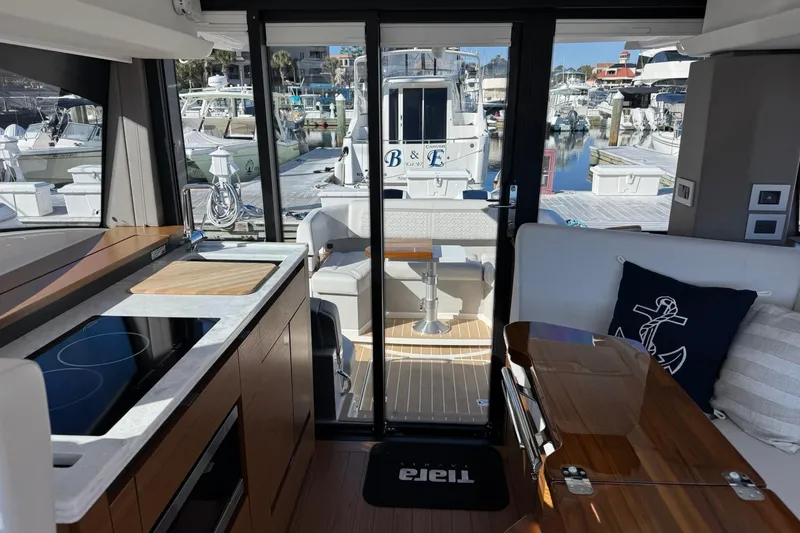  Yacht Photos Pics Interior of 2025 Tiara Yachts 43 LE, featuring modern kitchen and marina view.