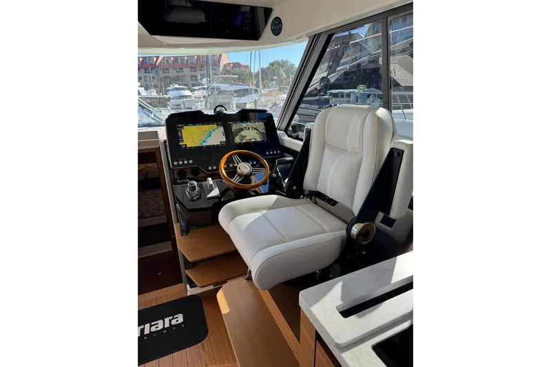  Yacht Photos Pics 2025 Tiara Yachts 43 LE helm with modern navigation displays and luxurious seating.