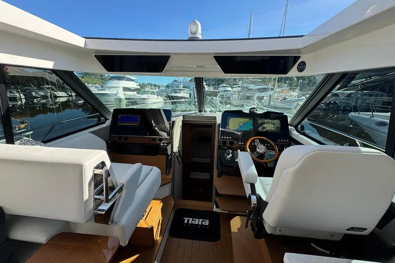  Yacht Photos Pics Interior of 2025 Tiara Yachts 43 LE, featuring modern navigation systems and luxurious seating.