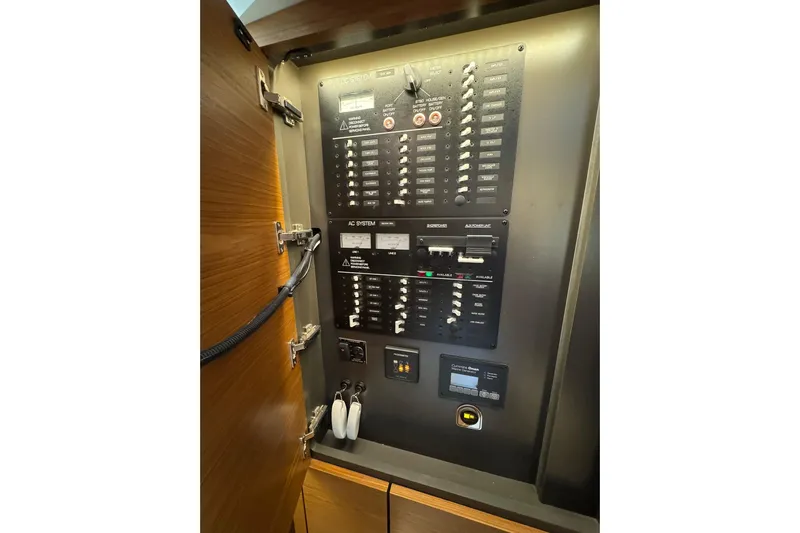  Yacht Photos Pics Electrical control panel inside 2025 Tiara Yachts 43 LE, showcasing switches and circuit breakers.