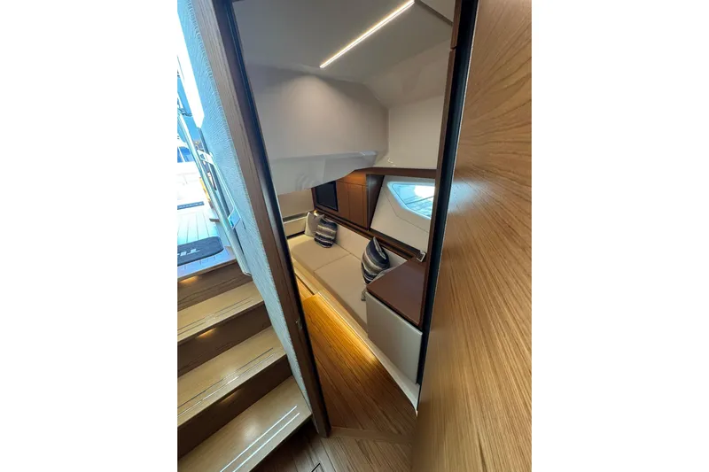  Yacht Photos Pics 2025 Tiara Yachts 43 LE interior cabin with modern wood finish and cozy seating.