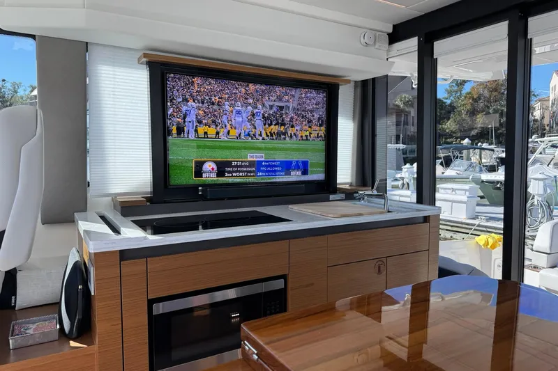  Yacht Photos Pics Interior of 2025 Tiara Yachts 43 LE with TV and kitchenette.