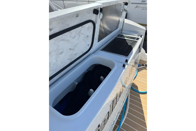  Yacht Photos Pics 2025 Tiara Yachts 43 LE deck storage and grill area, showcasing modern design.