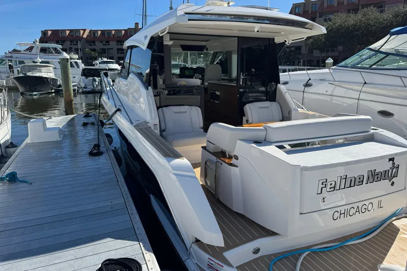  Yacht Photos Pics 2025 Tiara Yachts 43 LE docked, featuring sleek design and luxurious seating.