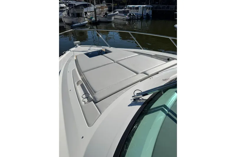  Yacht Photos Pics 2025 Tiara Yachts 43 LE boat with cushioned deck, docked in marina.