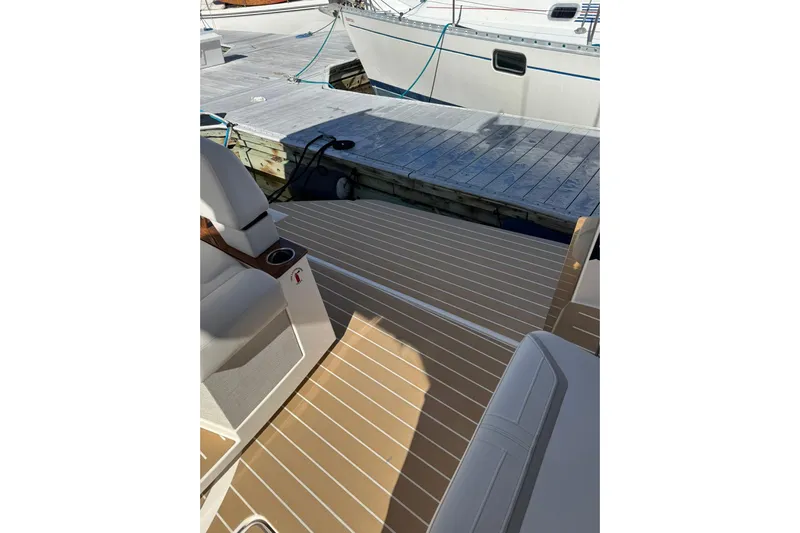  Yacht Photos Pics 2025 Tiara Yachts 43 LE boat deck with seating, docked at marina.