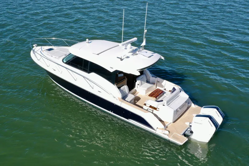  Yacht Photos Pics 2025 Tiara Yachts 43 LE cruising on open water, showcasing sleek design and powerful engines.