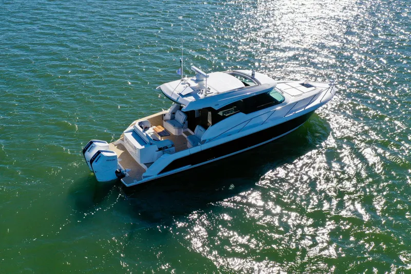  Yacht Photos Pics 2025 Tiara Yachts 43 LE cruising on sparkling water.