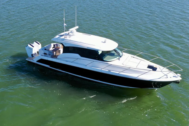  Yacht Photos Pics 2025 Tiara Yachts 43 LE cruising on open water, showcasing sleek design and modern features.