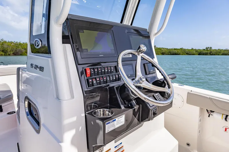  Yacht Photos Pics Manufacturer Provided Image: 2025 Pursuit S 248 Sport boat console with steering wheel and navigation system.
