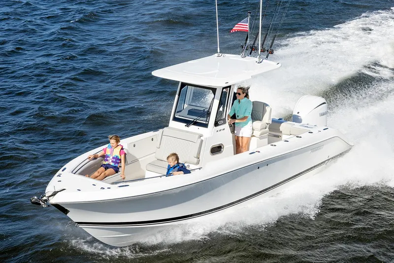  Yacht Photos Pics Manufacturer Provided Image: 2025 Pursuit S 248 Sport boat cruising with passengers on open water.