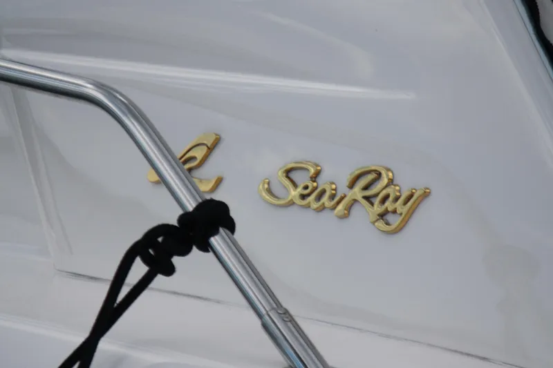 Knot Ez II Yacht Photos Pics Gold "Sea Ray" logo on a 1998 Sea Ray 450 Sundancer yacht.