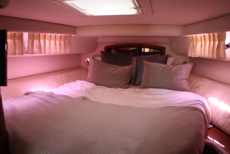 Knot Ez II Yacht Photos Pics Luxurious cabin interior of 1998 Sea Ray 450 Sundancer yacht with cozy bedding.