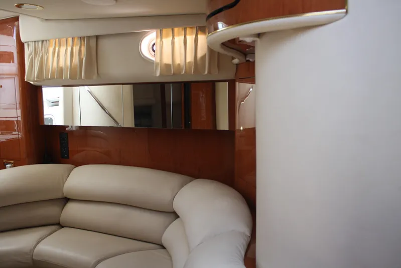 Knot Ez II Yacht Photos Pics Luxurious interior of 1998 Sea Ray 450 Sundancer yacht with plush seating.