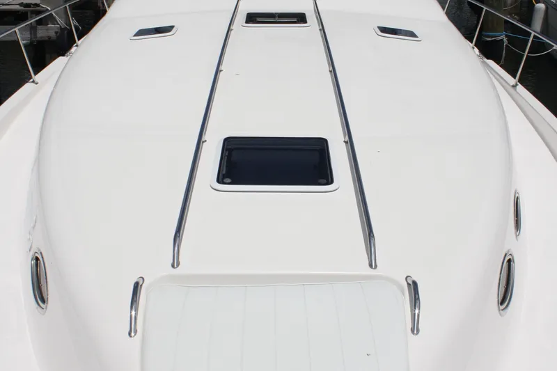 Knot Ez II Yacht Photos Pics 1998 Sea Ray 450 Sundancer yacht deck with sleek design and hatch windows.