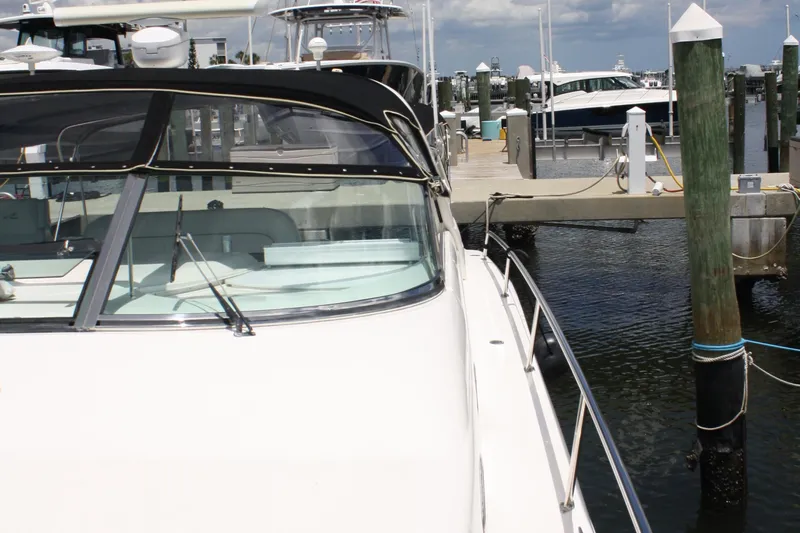 Knot Ez II Yacht Photos Pics 1998 Sea Ray 450 Sundancer yacht docked at marina, sunny day, calm waters.