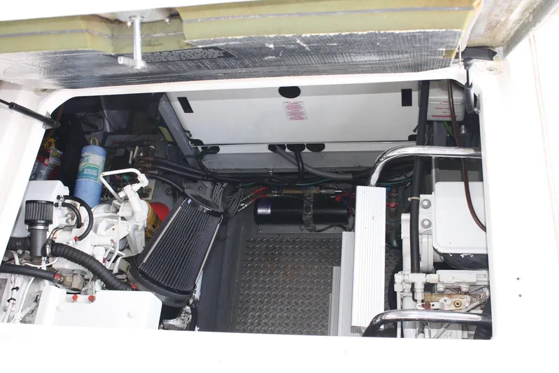 Knot Ez II Yacht Photos Pics Engine compartment of a 1998 Sea Ray 450 Sundancer boat, showcasing mechanical components.