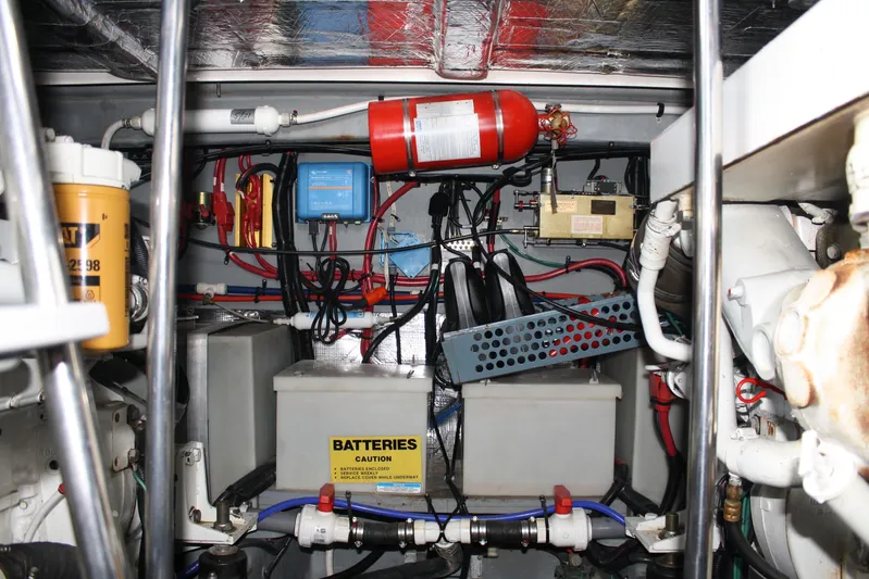 Knot Ez II Yacht Photos Pics Engine room of a 1998 Sea Ray 450 Sundancer with batteries and wiring.