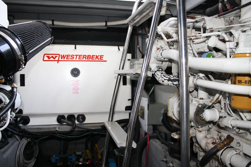 Knot Ez II Yacht Photos Pics Engine room of 1998 Sea Ray 450 Sundancer with Westerbeke generator and mechanical components.