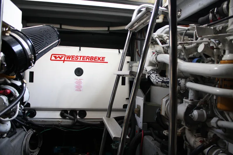 Knot Ez II Yacht Photos Pics Engine room of 1998 Sea Ray 450 Sundancer with Westerbeke generator visible.