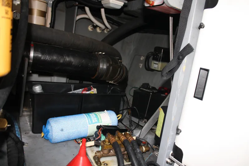 Knot Ez II Yacht Photos Pics Engine compartment of a 1998 Sea Ray 450 Sundancer with various mechanical components.