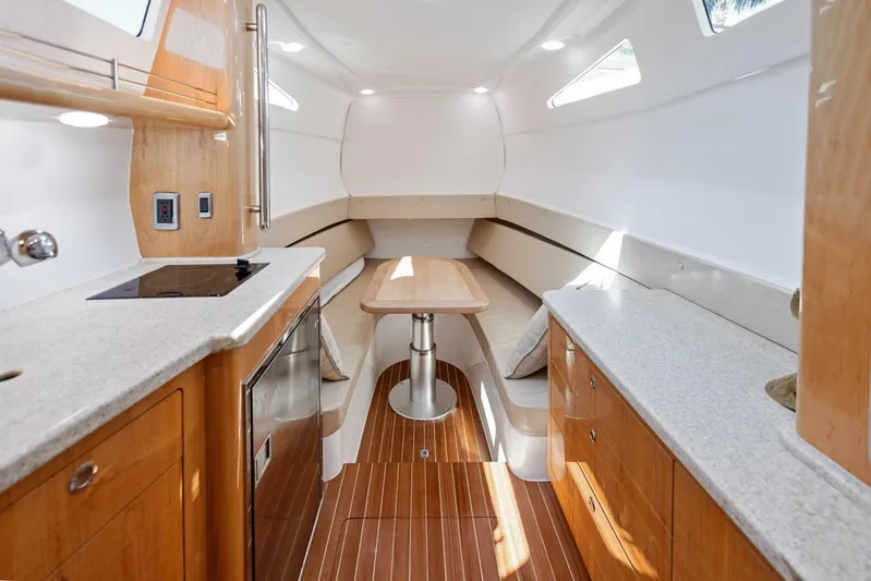  Yacht Photos Pics 2015 Intrepid 475 Panacea cabin interior with modern kitchen and seating area.