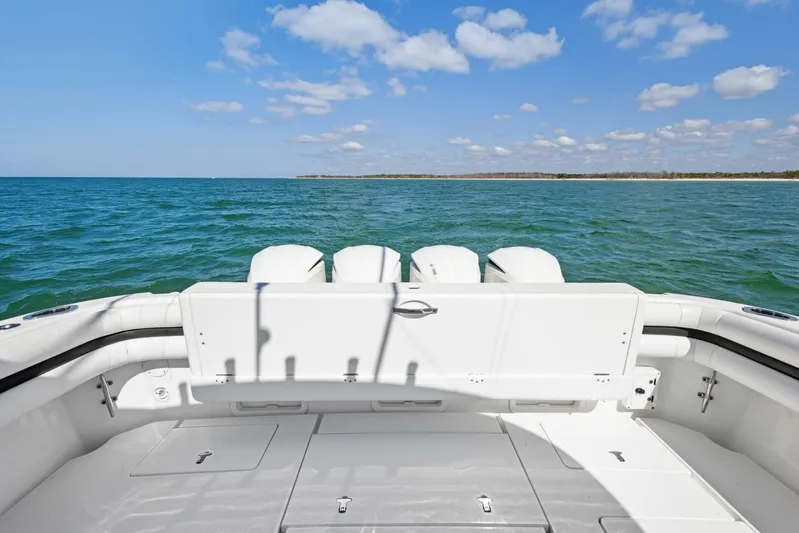  Yacht Photos Pics 2015 Intrepid 475 Panacea boat with ocean view, featuring sleek white deck design.