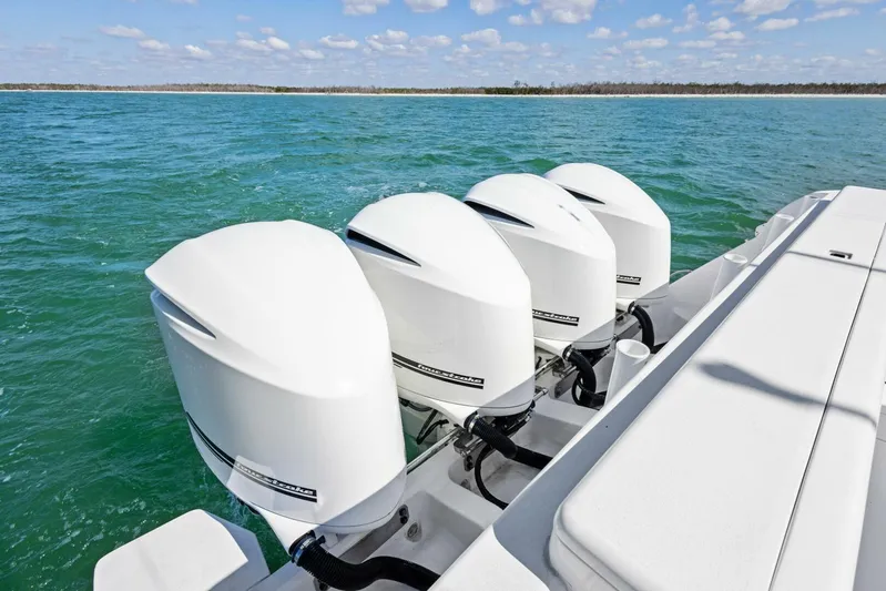  Yacht Photos Pics 2015 Intrepid 475 Panacea with four powerful outboard engines on turquoise water.