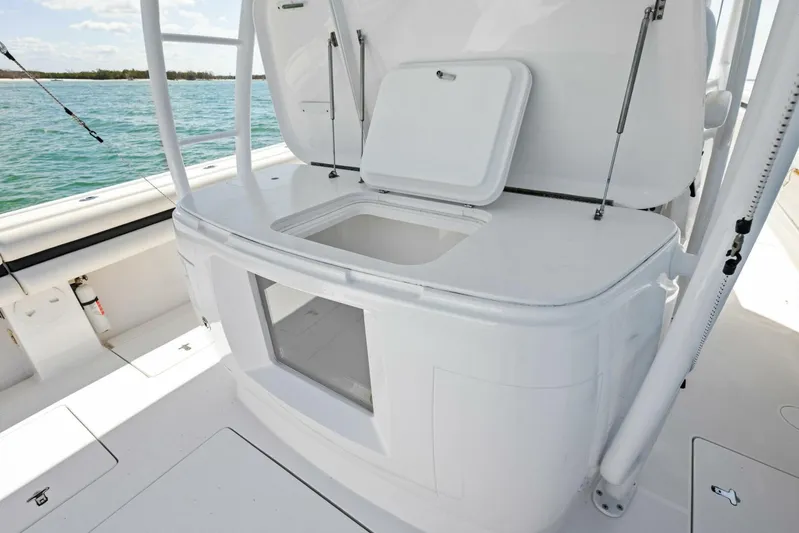  Yacht Photos Pics 2015 Intrepid 475 Panacea boat with open storage compartment on deck.