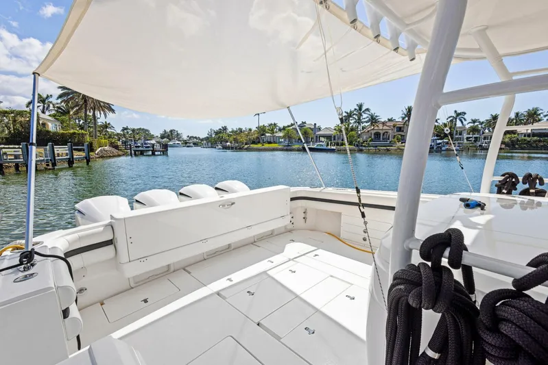  Yacht Photos Pics 2015 Intrepid 475 Panacea boat with spacious deck, docked in a scenic waterfront location.