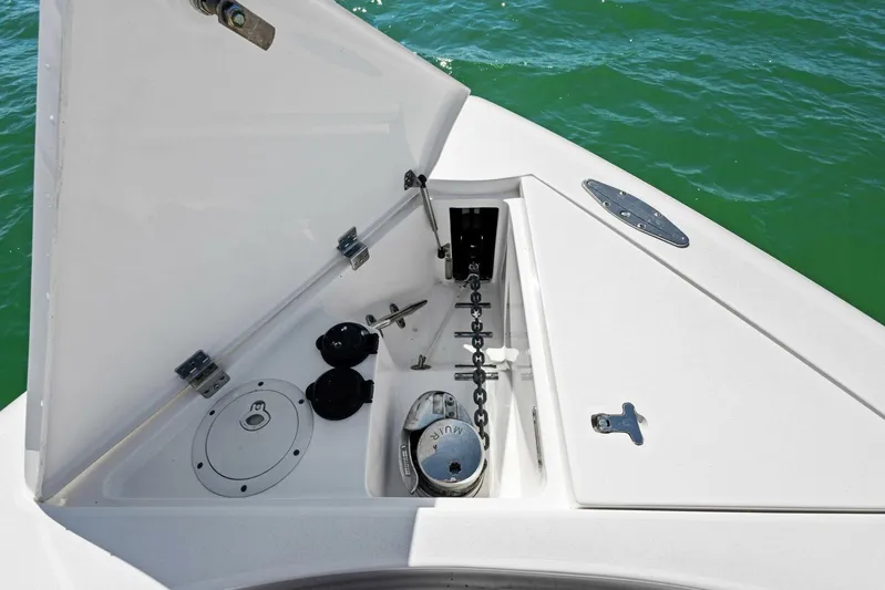  Yacht Photos Pics Anchor compartment of 2015 Intrepid 475 Panacea boat, open hatch, and chain mechanism.