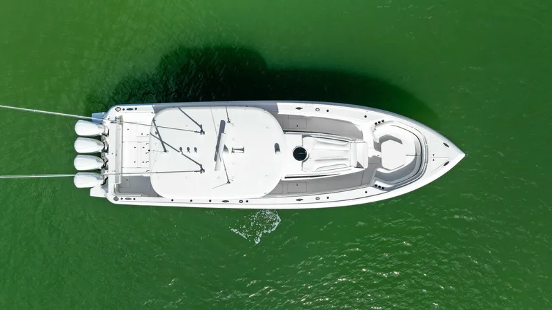  Yacht Photos Pics Aerial view of 2015 Intrepid 475 Panacea boat on green water.