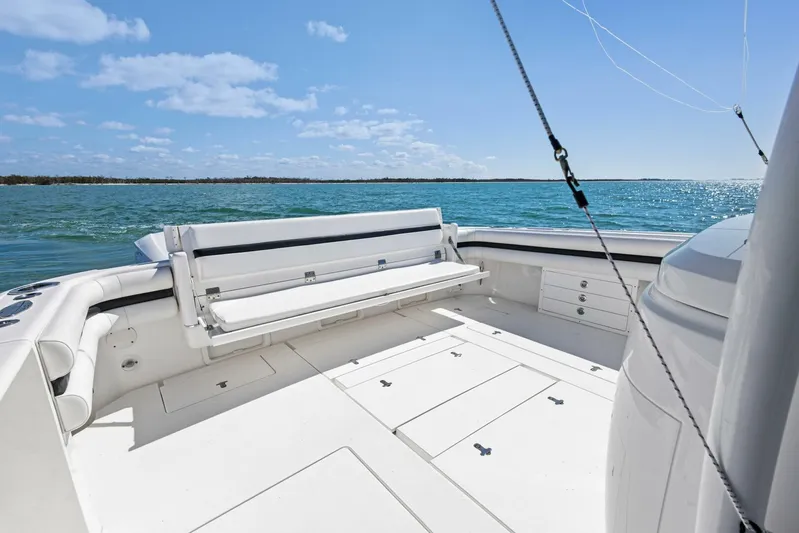  Yacht Photos Pics 2015 Intrepid 475 Panacea boat deck with seating, overlooking calm blue waters.