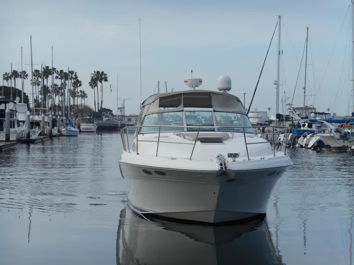 Cygnus Yacht Photos Pics 2000 Sea Ray Sundancer 410 yacht docked in a marina, surrounded by other boats.