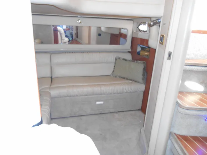 Cygnus Yacht Photos Pics Interior of 2000 Sea Ray Sundancer 410 yacht with beige seating and mirror.