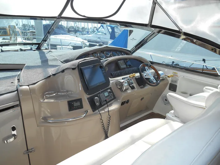Cygnus Yacht Photos Pics Cockpit of 2000 Sea Ray Sundancer 410 yacht with navigation equipment and steering wheel.