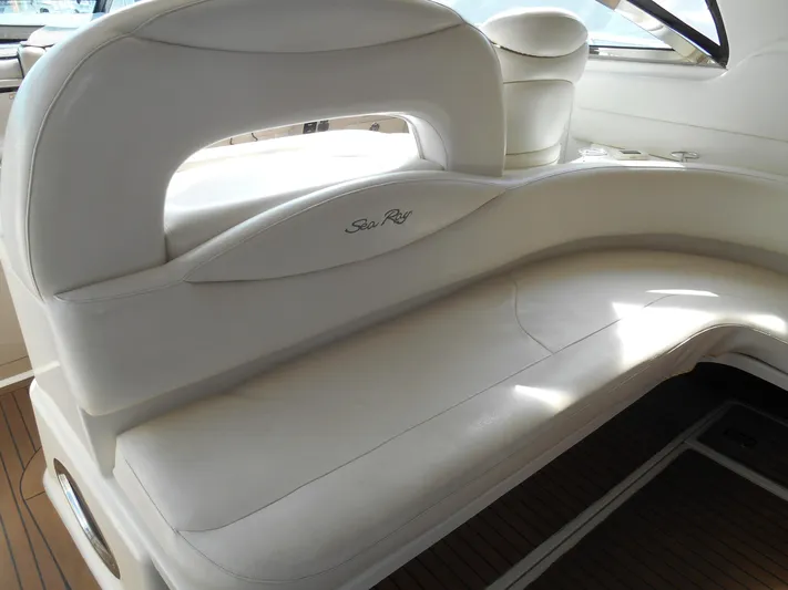 Cygnus Yacht Photos Pics 2000 Sea Ray Sundancer 410 interior seating with white upholstery.