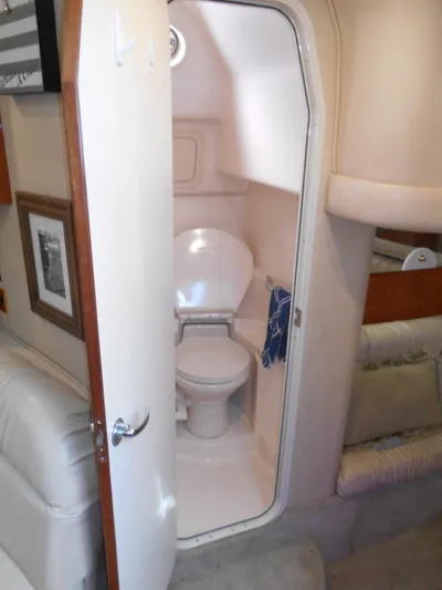 Cygnus Yacht Photos Pics Interior of 2000 Sea Ray Sundancer 410 yacht showing compact bathroom with toilet.