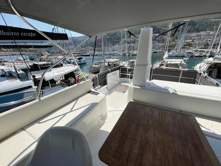  Yacht Photos Pics 2024 Beneteau Swift Trawler 41 Fly, spacious deck view at marina.