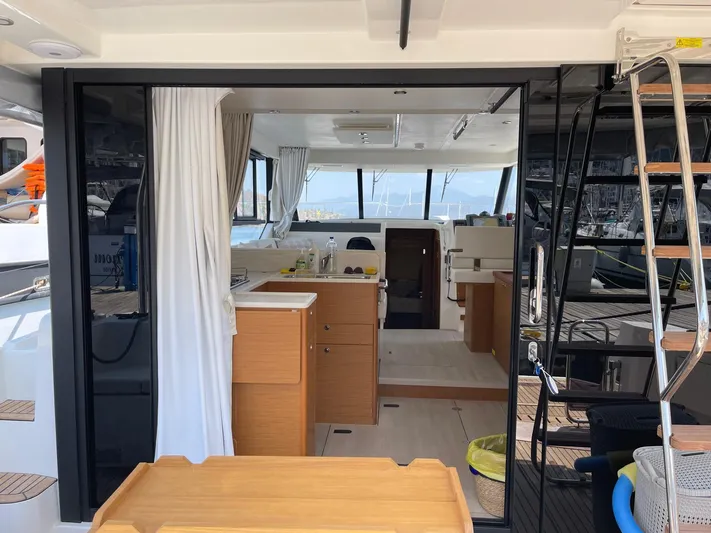  Yacht Photos Pics 2024 Beneteau Swift Trawler 41 Fly interior with modern kitchen and seating area.