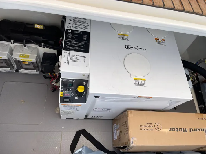  Yacht Photos Pics Engine compartment of 2024 Beneteau Swift Trawler 41 Fly with generator and battery setup.