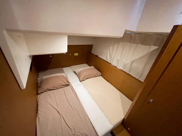  Yacht Photos Pics 2024 Beneteau Swift Trawler 41 Fly cabin with twin beds and cozy interior.